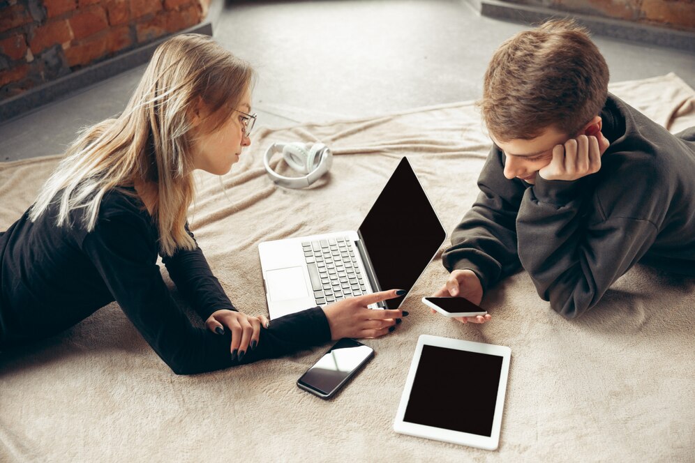 attractive surprised amazed couple using devices together 155003 6532