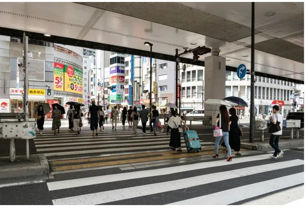 Business Professionals Compare Living Costs Between Tokyo and Osaka