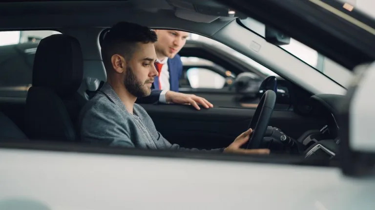 Modern car dashboard displaying advanced technology features including touchscreen, digital controls, and connectivity options