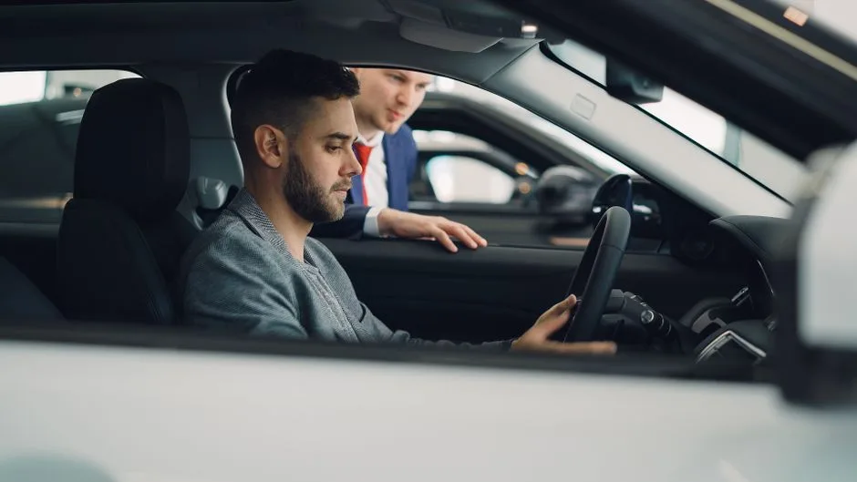 Modern car dashboard displaying advanced technology features including touchscreen, digital controls, and connectivity options