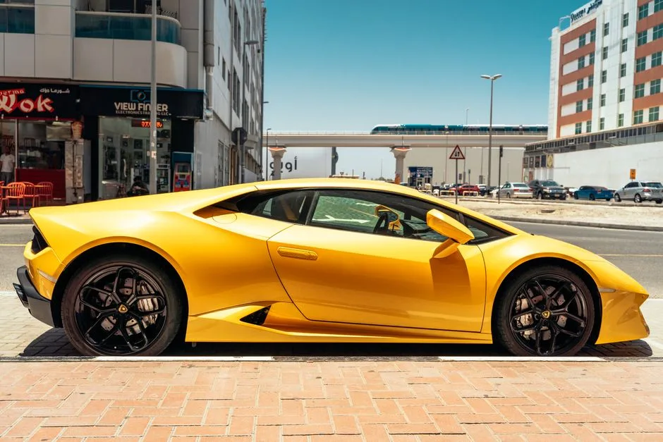 Luxury supercars parked in Dubai with palm trees and modern skyscrapers in the background during winter season