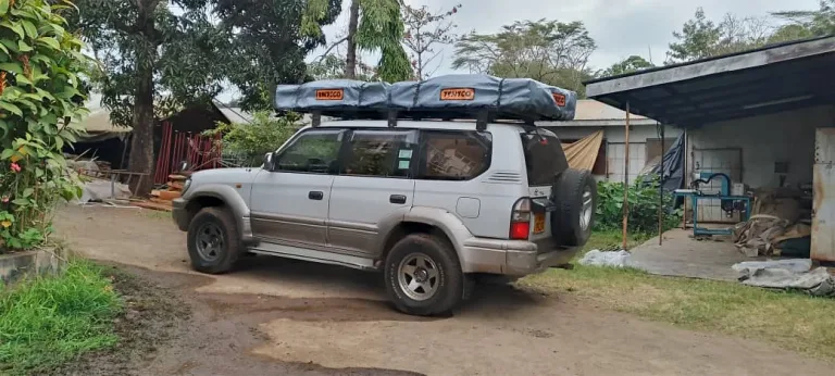 Map showing self-drive safari route from Uganda to Kenya with 4x4 vehicle traversing scenic African landscapes
