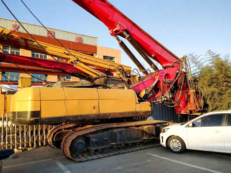 Used excavators and construction equipment lined up at a Chinese machinery market ready for international resale