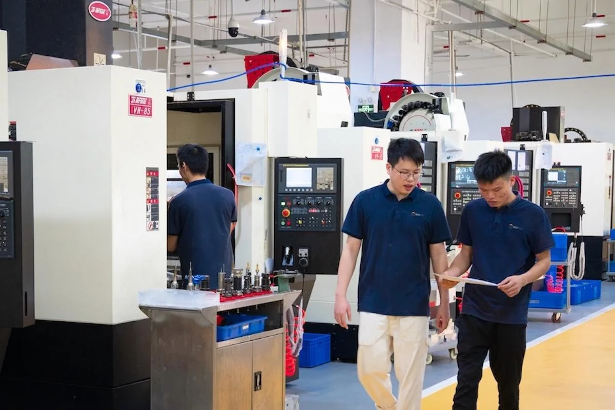 Five-axis CNC machine manufacturing precision robotic components at WayKen facility