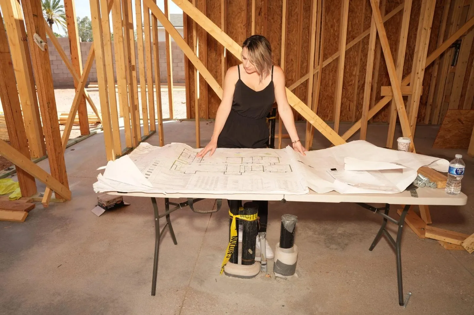 Luxury high-rise building under construction with exposed framework, highlighting governance challenges in residential development